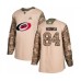 Men Carolina Hurricanes #84 Anttoni Honka Authentic Camo Veterans Day Practice Hockey Stitched Jersey